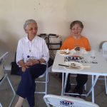 Participantes reunidos às mesas no encontro da Festa de Nossa Senhora do Calvário