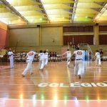 Apresentação de capoeira no ginásio durante a Semana Cultural